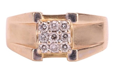 An angular diamond-set cluster ring, the nine round brilliant diamonds claw-set in a square design