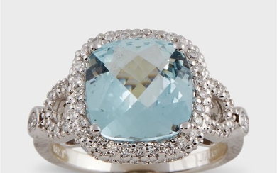 An aquamarine, diamond, and eighteen karat white gold ring...