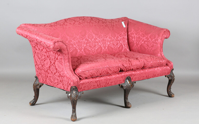 An early 20th century Queen Anne style mahogany settee, upholstered in foliate patterned claret dama