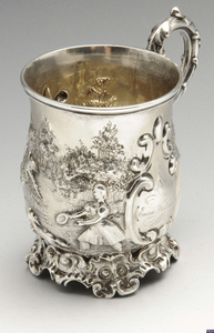 An early Victorian embossed silver christening mug.