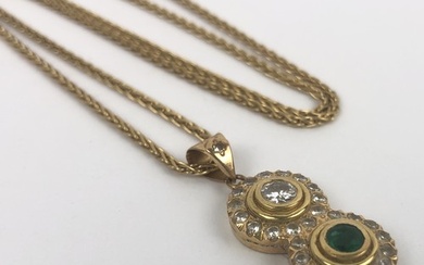 An emerald and diamond pendant, on a 18ct gold chain