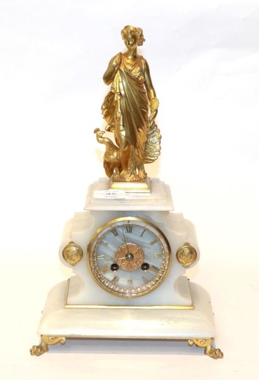 An onyx striking figural mantel clock
