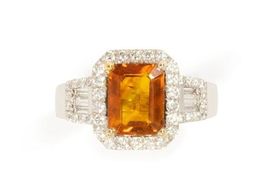 An orange sapphire, diamond and fourteen karat white