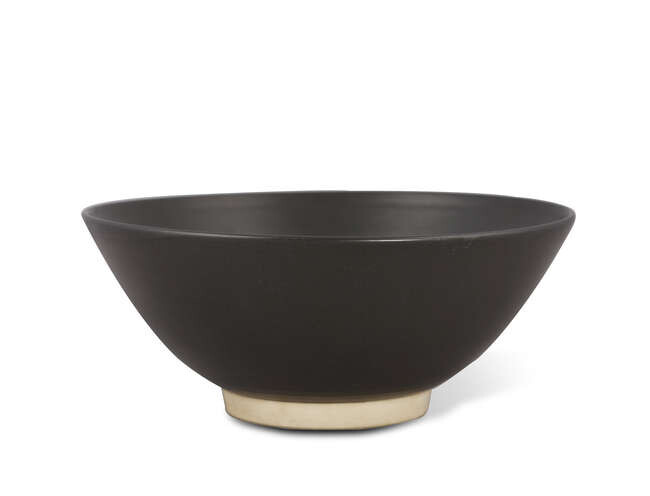 BOWL A black glazed pottery bowl. America, contemporary....