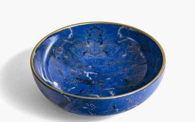 Bol - Christian Dior, Italie Porcelaine. Imitation lapis-lazuli, marbré. Particules d'or fondues. Bordures dorées sur...