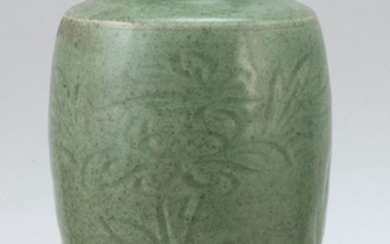 CHINESE CARVED CELADON STONEWARE VASE In baluster form, with foliate designs. Height 10.25".
