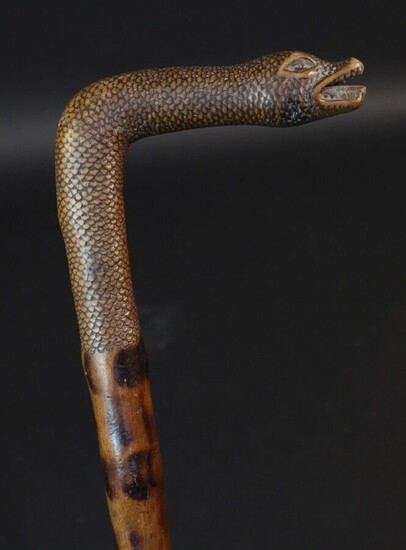 Monoxyle cane representing a snake. Very fine execution with meticulous representation of the scales. Height 86,5cm