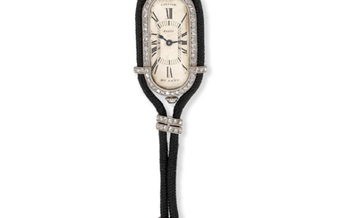 Cartier. A rare recently serviced platinum and diamond set keyless wind pendant watch suspended from a diamond set black neck cord Circa 1905