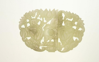 Carved pale celadon jade buckle with two sections