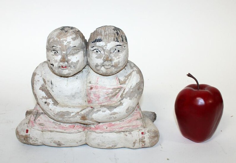 Chinese figural wood carving of couple embracing