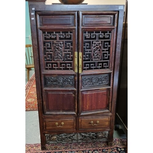 Chinese hardwood side cabinet with two geometrically pierced...