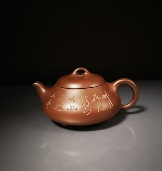 Chinese zisha teapot and cover.(Mark of Gu jingzhou)