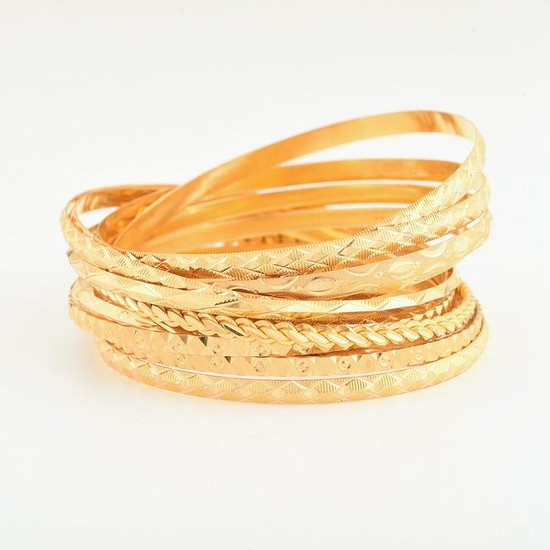 Collection of Twelve 22k Yellow Gold Bangle Bracelets.