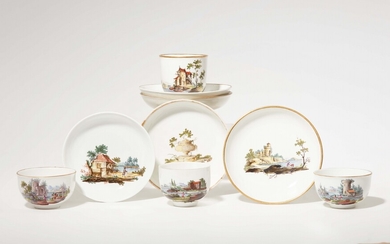 Four Fulda porcelain cups and five saucers with landscape decor
