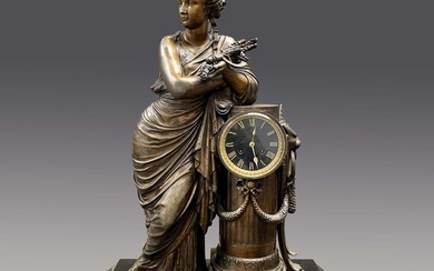 France, extra large patinated spelter figural clock, depicting a tall woman