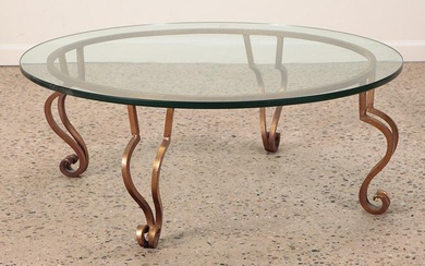 Gilt iron glass top coffee table in the manner of Ramsay C 1975. Ht: 16.25" Wd: 42"