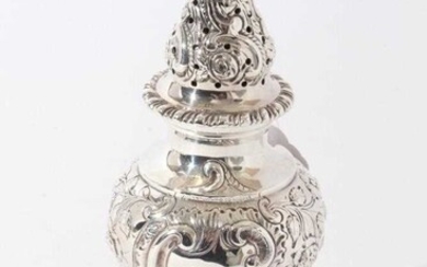 Good quality George V silver sugar castor with ornate embossed foliate and fruit decoration, raised on circular foor (London 1911), maker Goldsmiths & Silversmiths Co, 8oz, 20.5cm in height