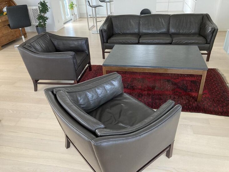 SOLD. Grandt design: Three seater sofa and a pair of easy chairs. Model 75. Further, a coffee table with top of black slate. (4) – Bruun Rasmussen Auctioneers of Fine Art