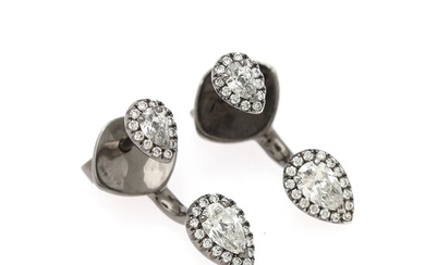 Hartmann's: A pair of diamond ear pendants each set with two pear-shaped diamonds encircled by numerous diamonds, mounted in 18k black rhodium plated gold.