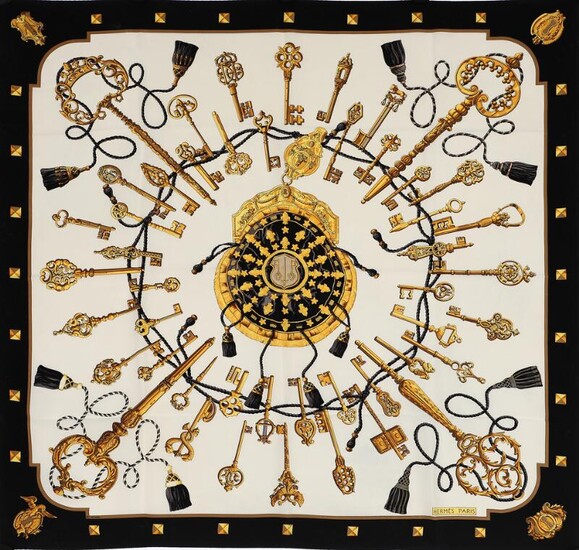 SOLD. Hermès: A silk scarf with motive "Les Clefs" by Caty Latham with golden and black print on a white background. – Bruun Rasmussen Auctioneers of Fine Art