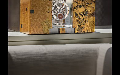 JAEGER-LECOULTRE. AN EXCEPTIONAL AND EXTREMELY RARE LIMITED EDITION WOOD MARQUETRY AND YELLOW SAPPHIRE-SET ATMOS CLOCK WITH REGULATOR STYLE, 24 HOUR DISPLAY, MONTH, MOON PHASES AND MOTHER-OF-PEARL DIAL ATMOS MARQUETERIE “GUSTAV KLIMT” PORTRAIT OF...