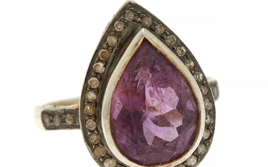 Jewels CPH: An amethyst and diamond ring set with a pear-shaped amethyst encircled by numerous sinlge-cut diamonds, mounted in sterling silver.