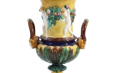 Large French Majolica Pottery Handled Urn with Embossed Putti Figures 21 inches height x 12 in.