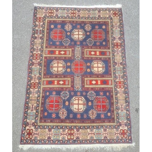Modern Eastern-style rug, the blue ground field with nine oc...