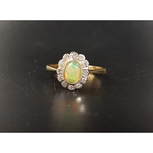 OPAL AND DIAMOND CLUSTER RING the central oval cabochon opal...