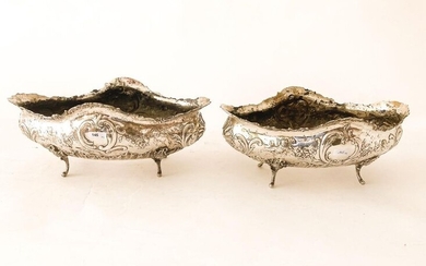 Pair of Rocaille quadripod planters, 19th century, chased silver, punch marks, l. 31 cm and 33 cm [wear and slight alterations].