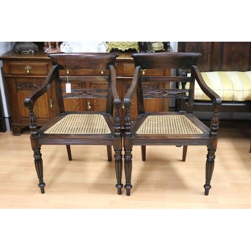 Pair of carved hardwood Anglo Indian elbow chairs with cane ...