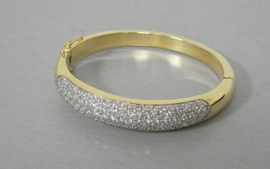 Rigid bracelet in yellow gold with an important...
