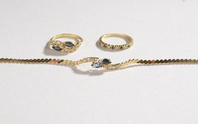 SET in yellow gold, sapphires and diamonds composed...