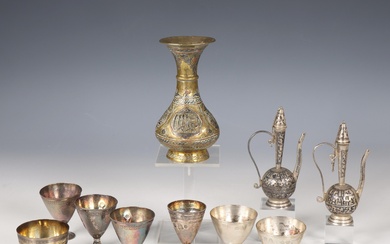 Seven Ottoman silver cups stamped with Tughra of the Sultan, two Caucasian (Russia) niello miniature flasks with lids and a brass vase decorated with text in silver and copper, 19th-20th century.