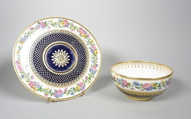 Small bowl and plate in porcelain enamelled with flowers and gilded with dots on a blue background.