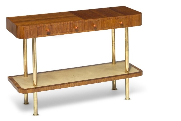 Torkov: A unique console of Zebrano with rounded front with two integrated drawers. Mounted on round brass legs. Made 1935 for Illums.
