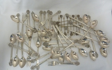 Various Thai flatware, each piece decorated with a a cast te...