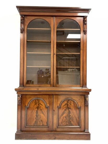 Victorian style mahogany bookcase, projecting cornice over leaf and...