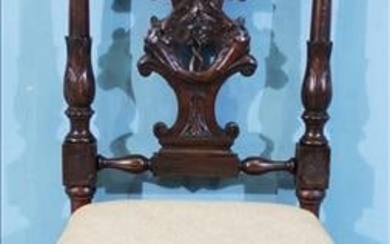 Walnut Victorian heavily carved side chair with carved crown