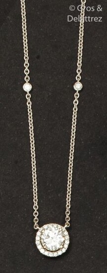 White gold necklace, set with a brilliant-cut diamond...