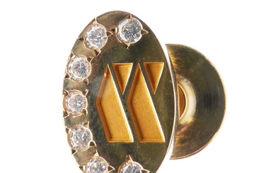 Yellow metal (14K) lapel badge, set seven diamonds
