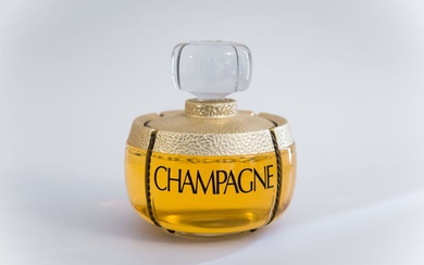 Yves Saint Laurent - "Champagne" (1992) Flacon publicitaire décoratif en verre incolore gainé de zamac...
