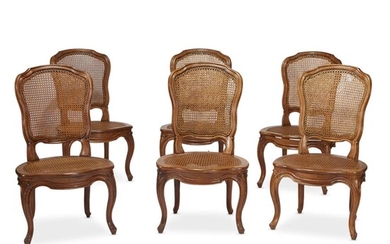 A suite of six Louis XV caned walnut dining...