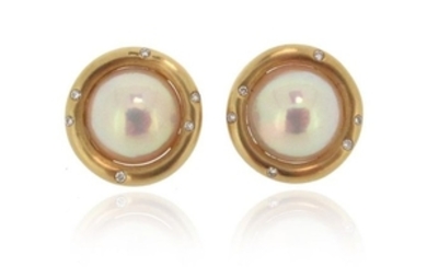 A pair of cultured mabé pearl and diamond ear clip…