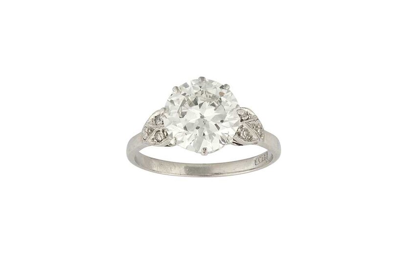 A diamond single-stone ring The brilliant-cut diamond, weighing 2.90...