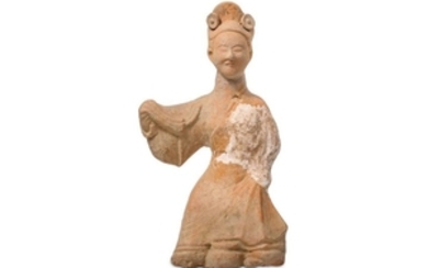 A CHINESE POTTERY FIGURE OF A DANCER.