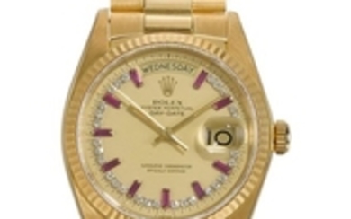 ROLEX | DAY-DATE REF 18038 A FINE AND RARE YELLOW GOLD AUTOMATIC CENTRE SECONDS WRISTWATCH WITH DAY, DATE, DIAMOND AND RUBY-SET DIAL AND BRACELET CIRCA 1980