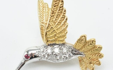 18 kt gold and diamond bird from pin with ruby eyes.