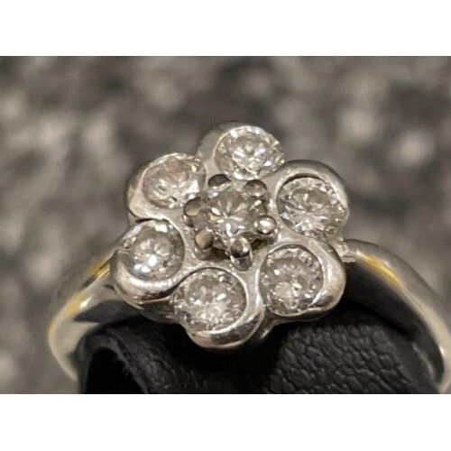 18ct white gold Diamond cluster ring. Comprising of 7 round ...