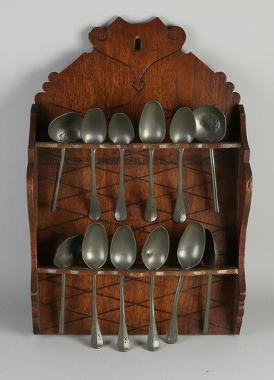 19th Century oak spoon rack with pewter spoons.&#160